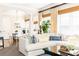 Comfortable living space featuring a large sectional sofa, expansive windows and decor-enhancing plants at 825 Glengate Pl, Atlanta, GA 30328