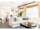 Comfortable living space featuring a large sectional sofa, expansive windows and decor-enhancing plants at 825 Glengate Pl, Atlanta, GA 30328