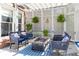 Charming covered patio with comfortable seating and a cozy fire pit creates an inviting outdoor space at 825 Glengate Pl, Atlanta, GA 30328