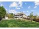 Aerial view of the backyard showcasing expansive lawn, privacy fence, and mature trees at 1301 Odell Ct, Hoschton, GA 30548