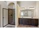 Bathroom with double vanity, modern fixtures, and a walk-in shower with black trim at 1301 Odell Ct, Hoschton, GA 30548