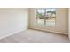 Cozy bedroom with neutral walls, carpet and large windows offering nice street view at 1301 Odell Ct, Hoschton, GA 30548