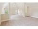 Open bonus room with natural light with a ceiling fan at 1301 Odell Ct, Hoschton, GA 30548