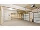 A spacious garage with an abundance of shelving and storage opportunities at 1301 Odell Ct, Hoschton, GA 30548