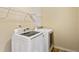 A conveniently located laundry room features a new washer and dryer set at 1301 Odell Ct, Hoschton, GA 30548