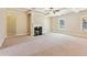 Spacious living room with a fireplace, large windows, and an open layout, perfect for Gathering gatherings at 1301 Odell Ct, Hoschton, GA 30548