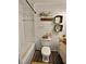 Charming bathroom features shiplap walls, stylish vanity and fixtures at 1320 Milstead Ne Ave, Conyers, GA 30012