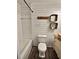 Charming bathroom features shiplap walls, stylish vanity and fixtures at 1320 Milstead Ne Ave, Conyers, GA 30012