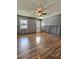 Bright living room featuring hardwood floors, textured ceilings, and stylish wood paneling at 1320 Milstead Ne Ave, Conyers, GA 30012