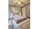 Elegantly staged bedroom with modern furniture, soft lighting, and plush carpeting, perfect for relaxation at 1320 Milstead Ne Ave, Conyers, GA 30012