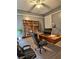 Well-appointed home office with ample shelving, modern desk, and comfortable seating for productivity at 1320 Milstead Ne Ave, Conyers, GA 30012