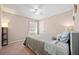 Relaxing bedroom is adorned with soft lighting and a ceiling fan at 181 Bridgewood Se Dr, Conyers, GA 30094