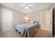 Cozy bedroom features neutral-colored walls, carpet, and a ceiling fan at 181 Bridgewood Se Dr, Conyers, GA 30094