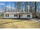 Charming single-story home with a brick foundation and freshly landscaped front yard at 181 Bridgewood Se Dr, Conyers, GA 30094