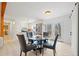 Bright kitchen dining area with stainless steel appliances, outside access, and stylish wood floors at 181 Bridgewood Se Dr, Conyers, GA 30094