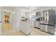 Bright and airy kitchen featuring stainless steel appliances, an island, and modern finishes at 181 Bridgewood Se Dr, Conyers, GA 30094