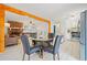 Open-concept living room features a decorative fireplace, wood floors and seamless flow with the kitchen at 181 Bridgewood Se Dr, Conyers, GA 30094