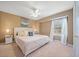 Serene main bedroom featuring neutral paint, natural light, and a ceiling fan for added comfort at 181 Bridgewood Se Dr, Conyers, GA 30094
