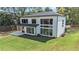 Aerial view of stylish residence showcasing modern design, covered patio and lush landscaping at 396 Academy St, Alpharetta, GA 30009