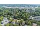 Aerial view showcasing the neighborhood's lush greenery and the city skyline in the distance at 396 Academy St, Alpharetta, GA 30009
