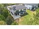 Aerial view showcases a home with a large yard and a patio seating area at 396 Academy St, Alpharetta, GA 30009