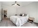 Bedroom with neutral walls, carpet, and large window overlooking the yard at 396 Academy St, Alpharetta, GA 30009