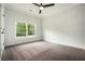 Bright bedroom with neutral carpet and paint, plus a large window with natural light at 396 Academy St, Alpharetta, GA 30009