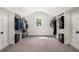 Large walk-in closet with built-in shelving and ample storage space at 396 Academy St, Alpharetta, GA 30009