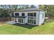 Aerial shot showcasing exterior of the house, large yard, and outdoor patio and seating area at 396 Academy St, Alpharetta, GA 30009