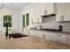 Modern kitchen with custom cabinets and granite countertops at 396 Academy St, Alpharetta, GA 30009