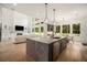 Open kitchen featuring a large island with seating and stainless steel appliances at 396 Academy St, Alpharetta, GA 30009