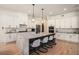 Kitchen with a large island, stainless steel appliances, and hardwood floors at 396 Academy St, Alpharetta, GA 30009