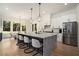 Kitchen with a large island, stainless steel appliances, and backyard views at 396 Academy St, Alpharetta, GA 30009
