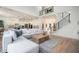 Open living room and kitchen with hardwood floors and backyard views at 396 Academy St, Alpharetta, GA 30009