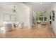 Bright living room with wooden floors and lots of natural light from windows at 396 Academy St, Alpharetta, GA 30009