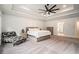 A large main bedroom with tray ceilings, carpeted floors, and neutral walls at 396 Academy St, Alpharetta, GA 30009