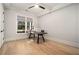 A well-lit home office with modern fixtures and a large window with backyard views creates an ideal workspace at 396 Academy St, Alpharetta, GA 30009