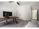 Spacious office with a ceiling fan and a gray sofa at 396 Academy St, Alpharetta, GA 30009