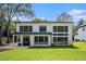 Stunning two-story home showcasing modern design and large windows overlooking the backyard at 396 Academy St, Alpharetta, GA 30009