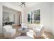 Bright seating area with wooden floors and lots of natural light from windows at 396 Academy St, Alpharetta, GA 30009
