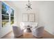 Cozy sitting area features wood floors, natural light and stylish decor at 396 Academy St, Alpharetta, GA 30009