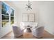 Bright seating area with wooden floors and lots of natural light from windows at 396 Academy St, Alpharetta, GA 30009