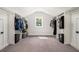 Spacious walk-in closet with ample storage and natural light at 396 Academy St, Alpharetta, GA 30009