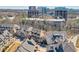 Aerial view of townhomes located near city buildings and lush greenery at 6601 Cadence Blvd, Atlanta, GA 30328