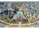 Community aerial view showcasing a swimming pool and modern clubhouse surrounded by townhomes at 6601 Cadence Blvd, Atlanta, GA 30328