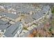 Extensive aerial view of a residential neighborhood featuring townhomes and mature trees at 6601 Cadence Blvd, Atlanta, GA 30328