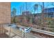 Outdoor balcony featuring raised garden beds, a brick wall, and an open view at 6601 Cadence Blvd, Atlanta, GA 30328