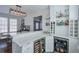 Modern bar area featuring quartz countertops, built in shelving and stainless steel appliances at 6601 Cadence Blvd, Atlanta, GA 30328