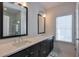 Elegant bathroom with a double vanity, modern fixtures, and a window at 6601 Cadence Blvd, Atlanta, GA 30328
