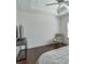 Bedroom features hardwood floors, a ceiling fan, and natural light from a window at 6601 Cadence Blvd, Atlanta, GA 30328